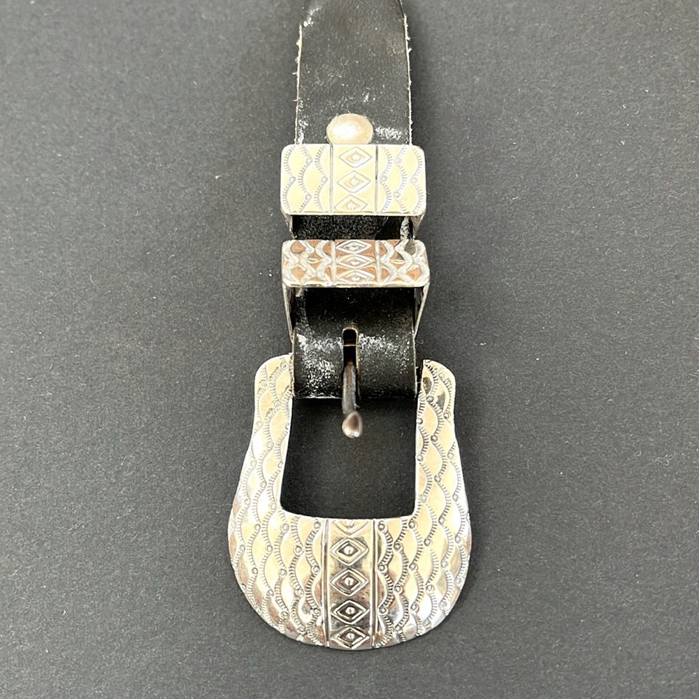 Silver belt buckle